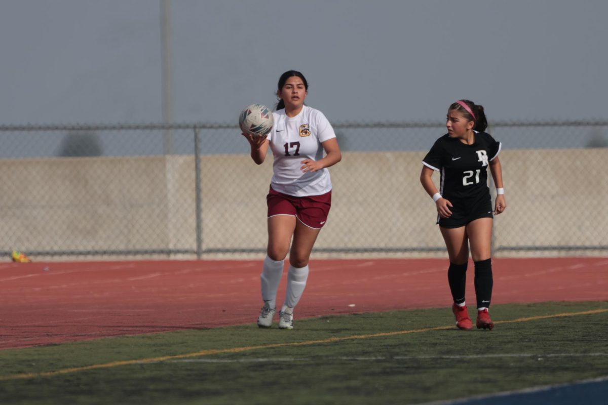 Valeria Moctezuma Ibarra grabs the ball and prepares for the quick inbound pass.