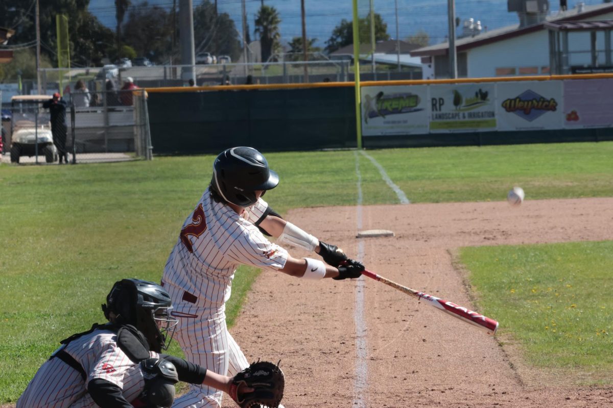 Steven Aguayo hits a triple during the opening game of a double header against Rancho Verde on Feb. 10.