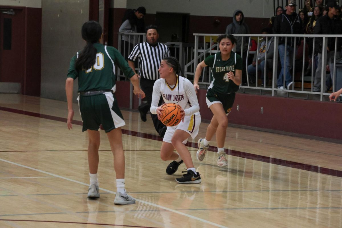 Zoey Espino pulls up to find the cutters at mid court on the fast break.