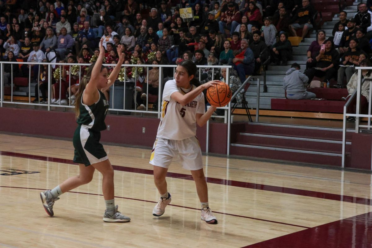 Jasmine Jimenez looks for the cutters in the lane as Notre Dame closes out on defense.