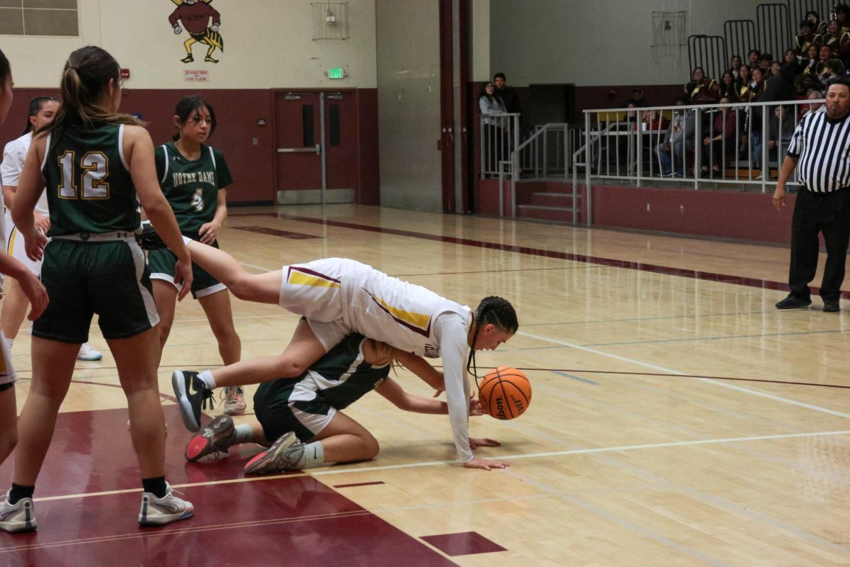 Zoey Espino dives for a loose ball during the tense fourth quarter against Notre Dame.