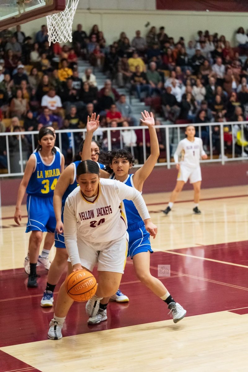 Mayra Morales pulls down a rebound and pulls out to help set up another play. Her rebounding was huge in the game as Colton found themselves outrebounded by the visitors.
