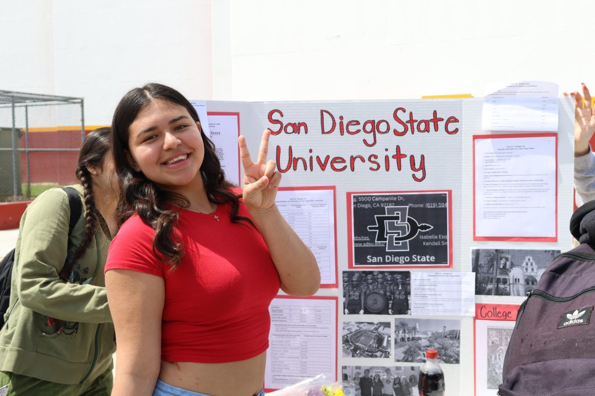 AVID Sophomore Kendall Smith shows off her presentation about San Diego State University at the annual College Fair.