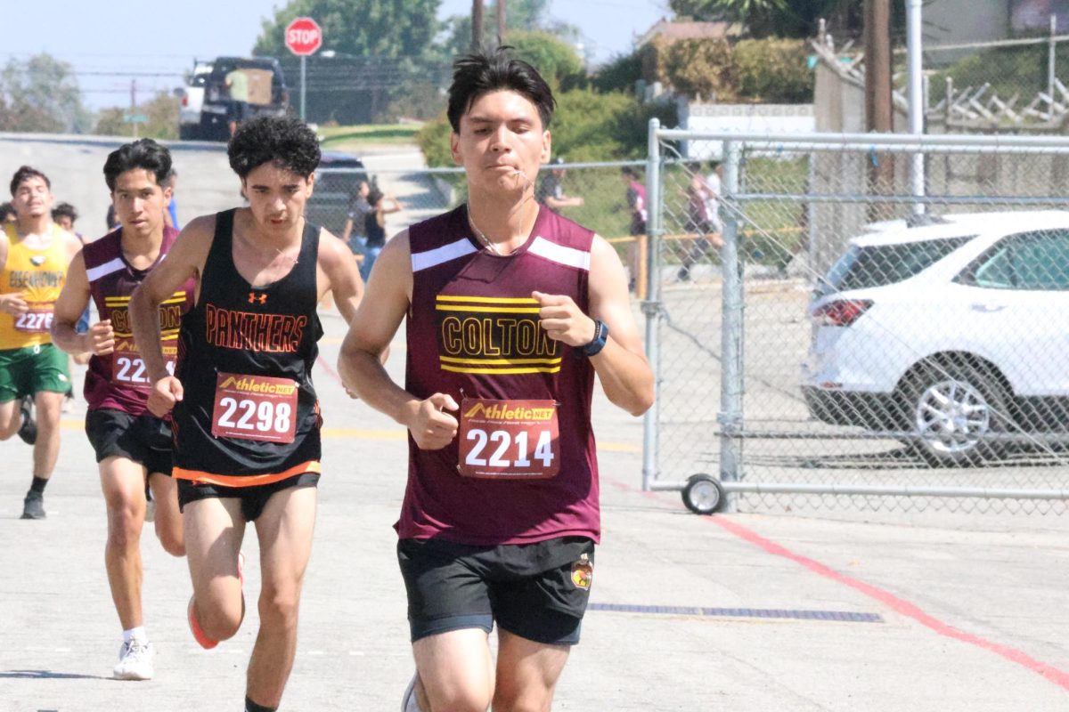 Colton High Senior Christopher Acero paves the way for his cross-country teammate as he takes the lead in front of Yahir Contreras from Entrepreneur High