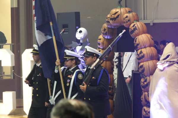 NJROTC waves their flags as everyone stands tall for the Pledge of Allegiance