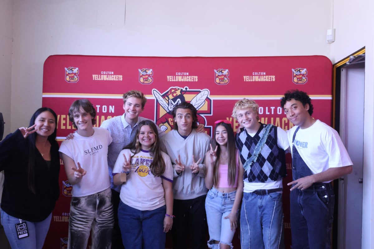 Yearbook Staff poses for a picture with The Full Circle Boys backstage