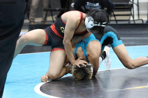 Elias Velasquez impressed by showing off his full arsenal of wrestling moves, but was still pushed into three overtime rounds. The team captain never quit, and won the match with a 4-3 decision.