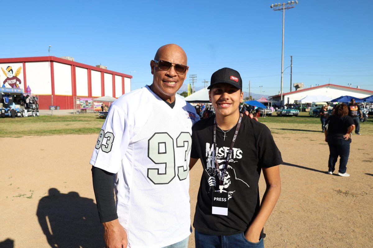 Ex Super Bowl Champ Greg Townsend stands with Pepper Bough Staff Writer Caleb Cabrera for a photo