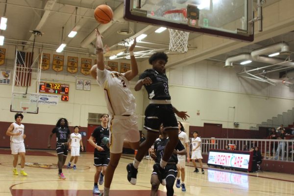 Zay Stuart takes a circus shot against Dos Lagos, looking for the and-1 opportunity as he sails out of bounds. Colton defeated Vista del Lago 71-54 on Nov. 20.