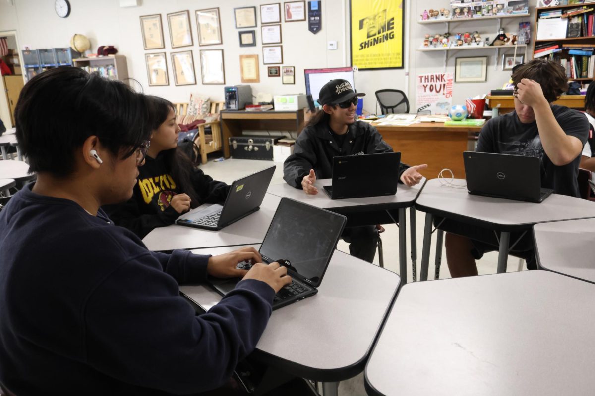 Student editors in Mr. Dollins' creative writing class discuss plans for the Colton Underground literary magazine. From left: Joseph Melara, Michele Jacome Cuevas, Rudy Martinez, Arthur Amaral.