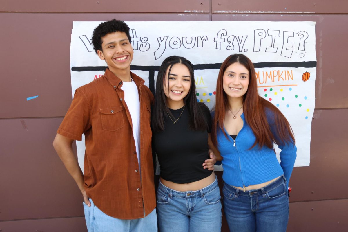 ASB members Adrian Diaz, Aubrey Rodriguez, and Jazlin Mendoza stop working for a few moments to get a quick photo together.