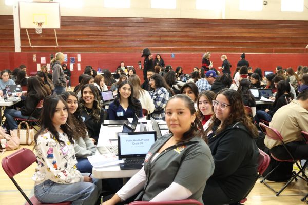 A group of HEAL students poses for a picture during their presentations