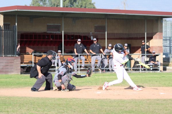 Steven Aguayo launches a double deep into left field to get the Yellowjacket offense going.