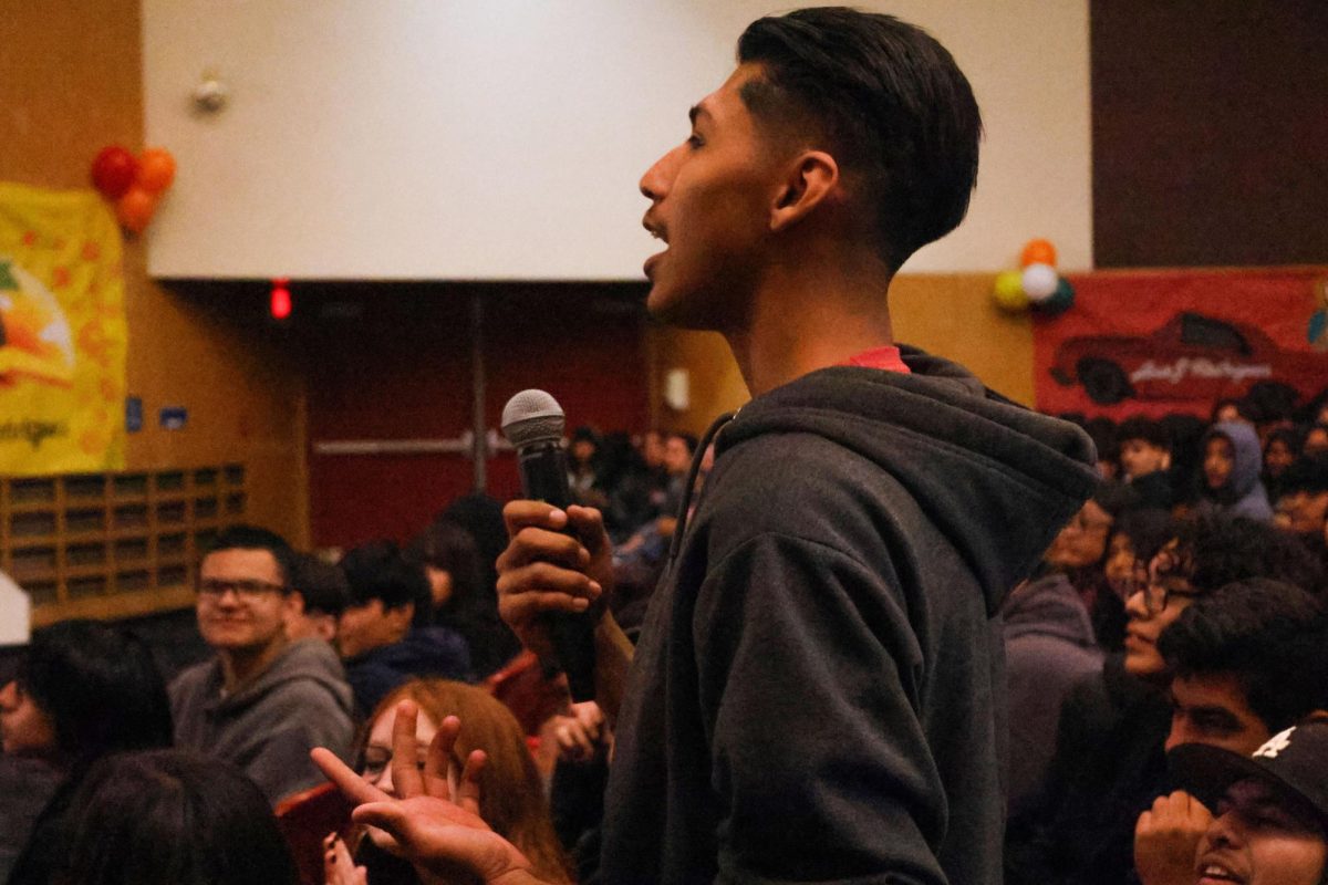 Senior Michael Rios asks a question during the Q&A session.