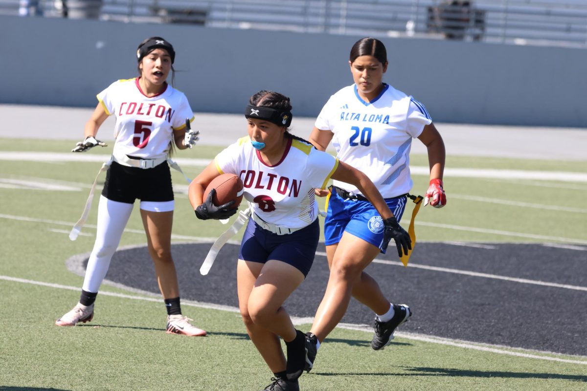 Junior Heidi Alarcon takes off against Alta Loma in Colton High's first ever flag football game.