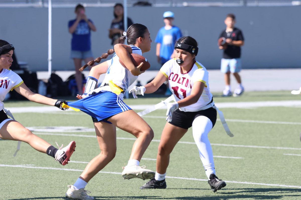 Dalissa and Dayla Rosas trap Alta Loma's runner in time to swipe her flag.