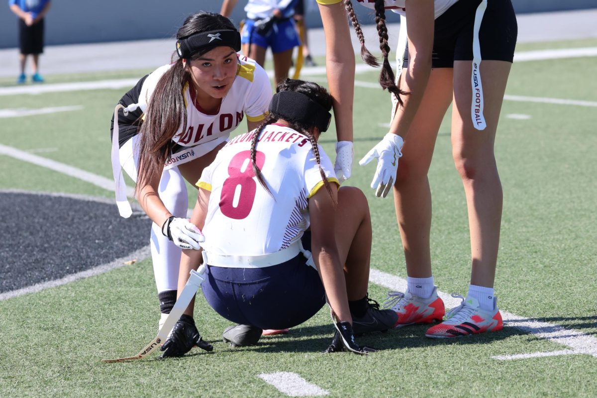 Dalissa Rosas and Salome Gonzalez rush to help teammate Heidi Alarcon up after a tough defensive play put Alarcon on the ground.