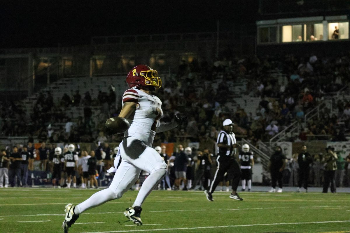 Julian Gonzalez takes the ball into the endzone on a 35-yard touchdown run after a Jurupa Valley fumble.