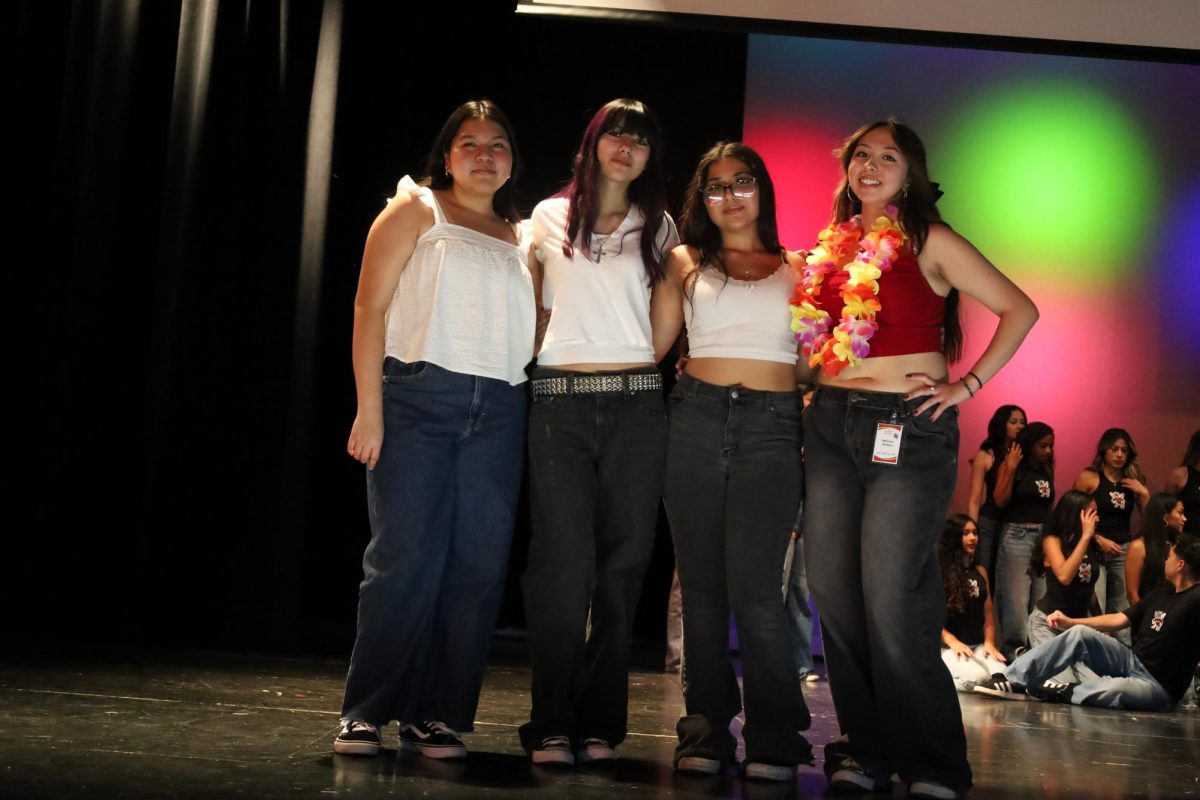 After the assembly, the New Generation Hip-Hop Club members pose for a cool pic under the stage lights.