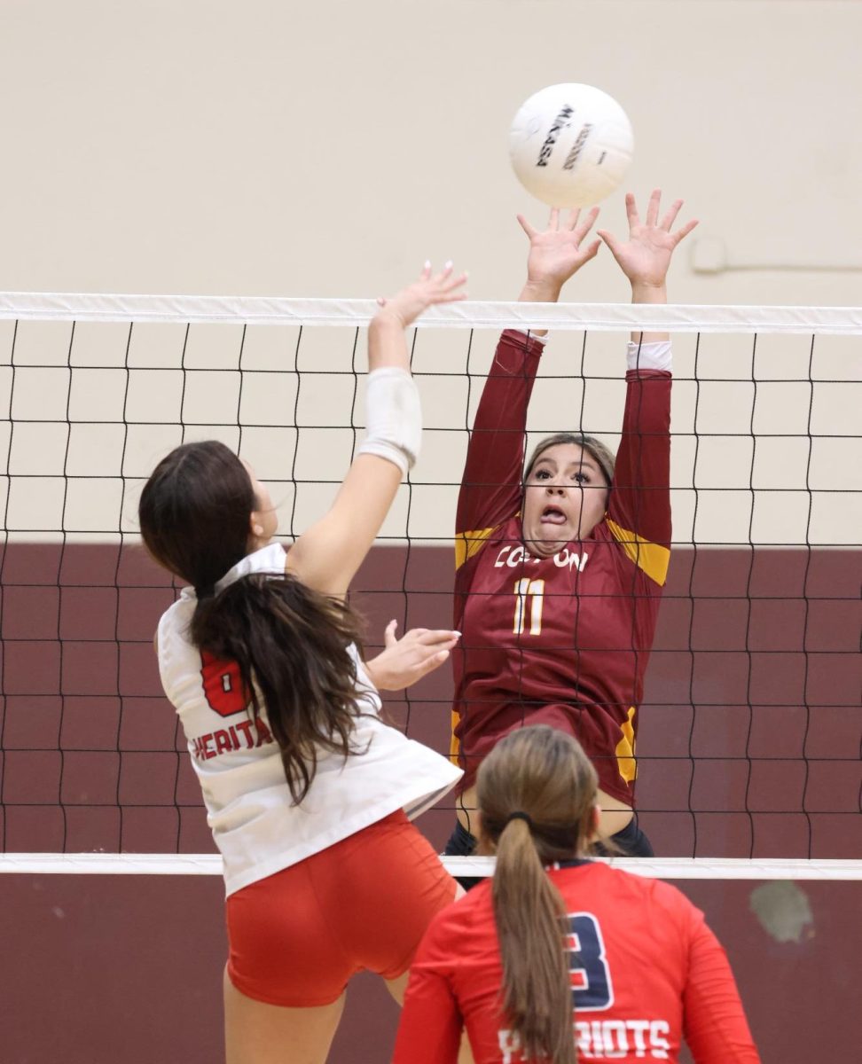 Andrea Llanes rises for the block against Heritage on Sep. 2.