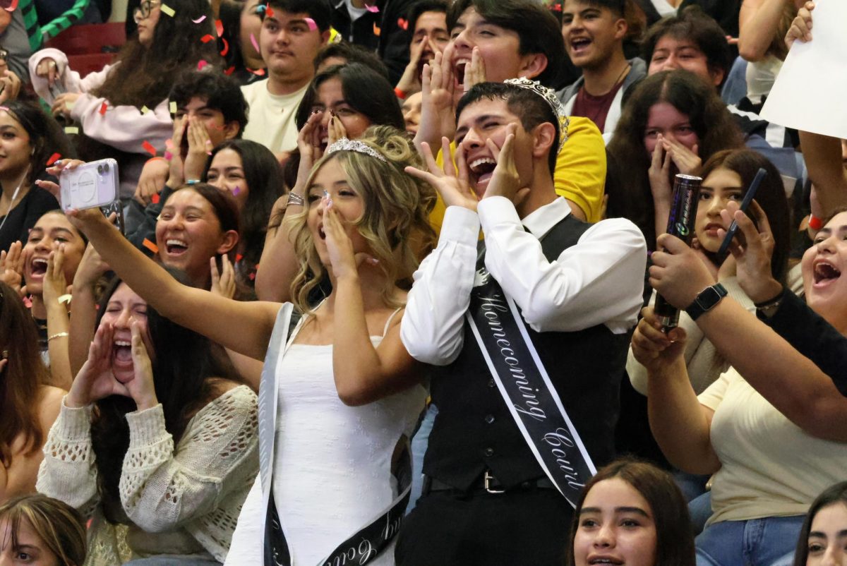 Homecoming Court honorees Yesenia Nunez and Yulior Zamora lead the Class of 2026's chant during the Homecoming Pep Rally.