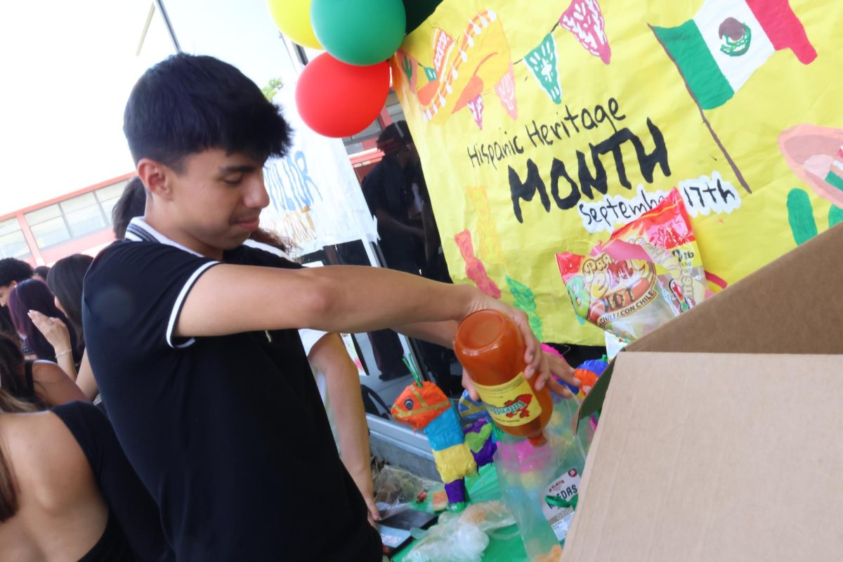 Senior Juan Luna prepares the Mexican chips for a hungry student.