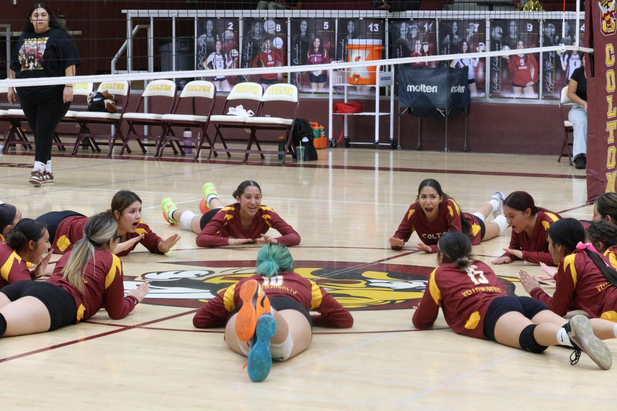 As part of tradition, after their victory, the Yellowjackets form a celebration circle at midcourt.