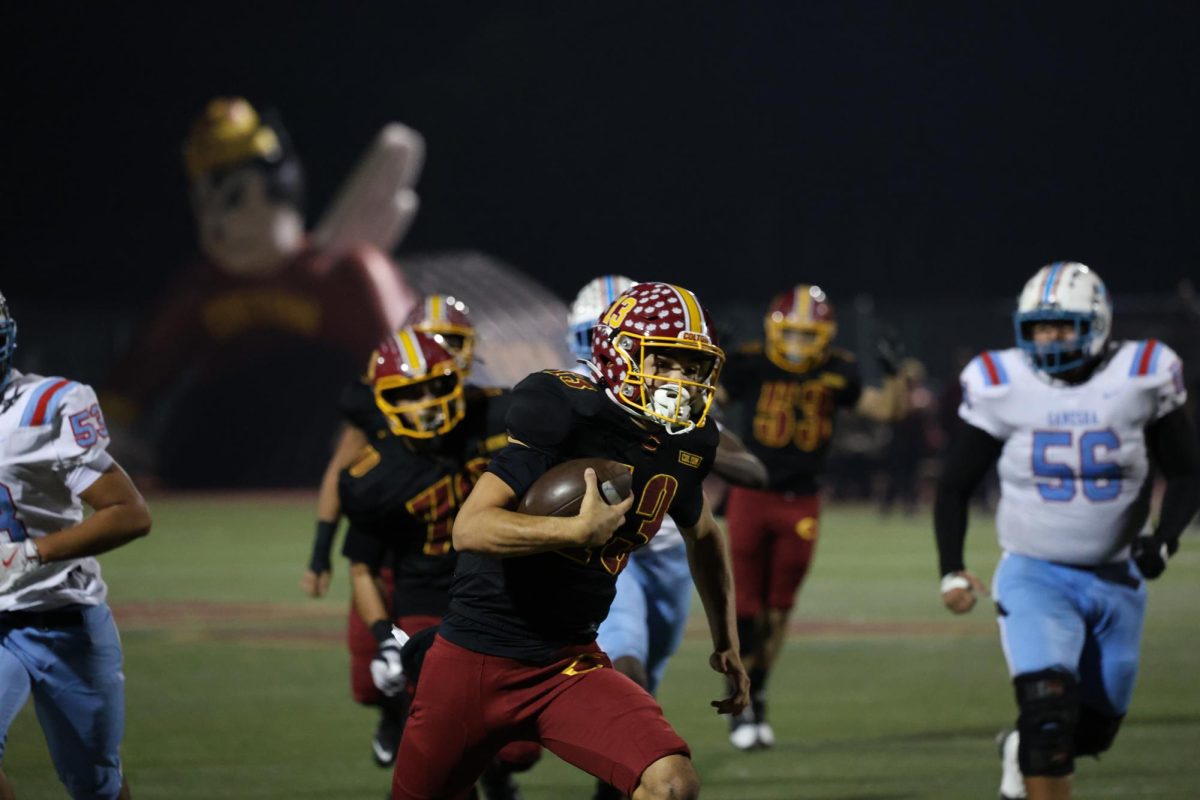 Koa Regalado rushes for a touchdown against Ganesha. He led Colton in rushing, with 69 yards.