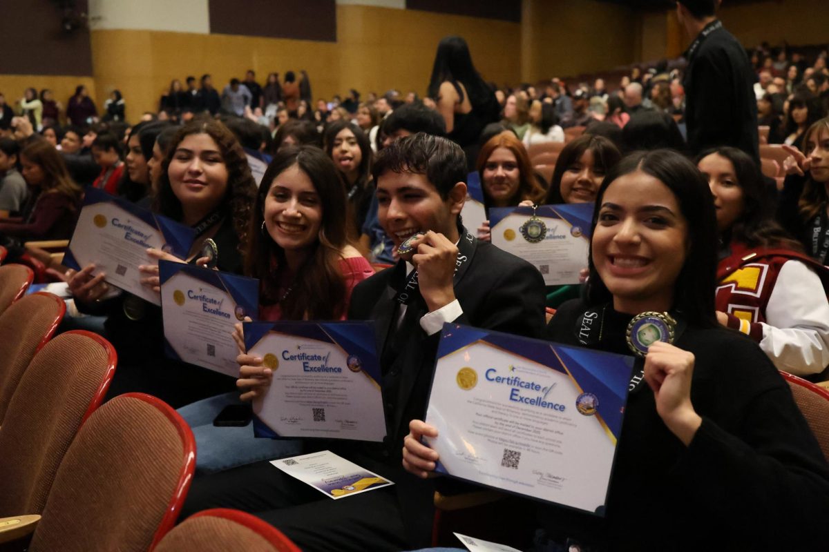 CHS students Dulce Delgado, Jazlin Mendoza, Yulior Zamora, and Sommer Santiago Niebla show off their Seal of Biliteracy awards at the ceremony on Nov. 19.