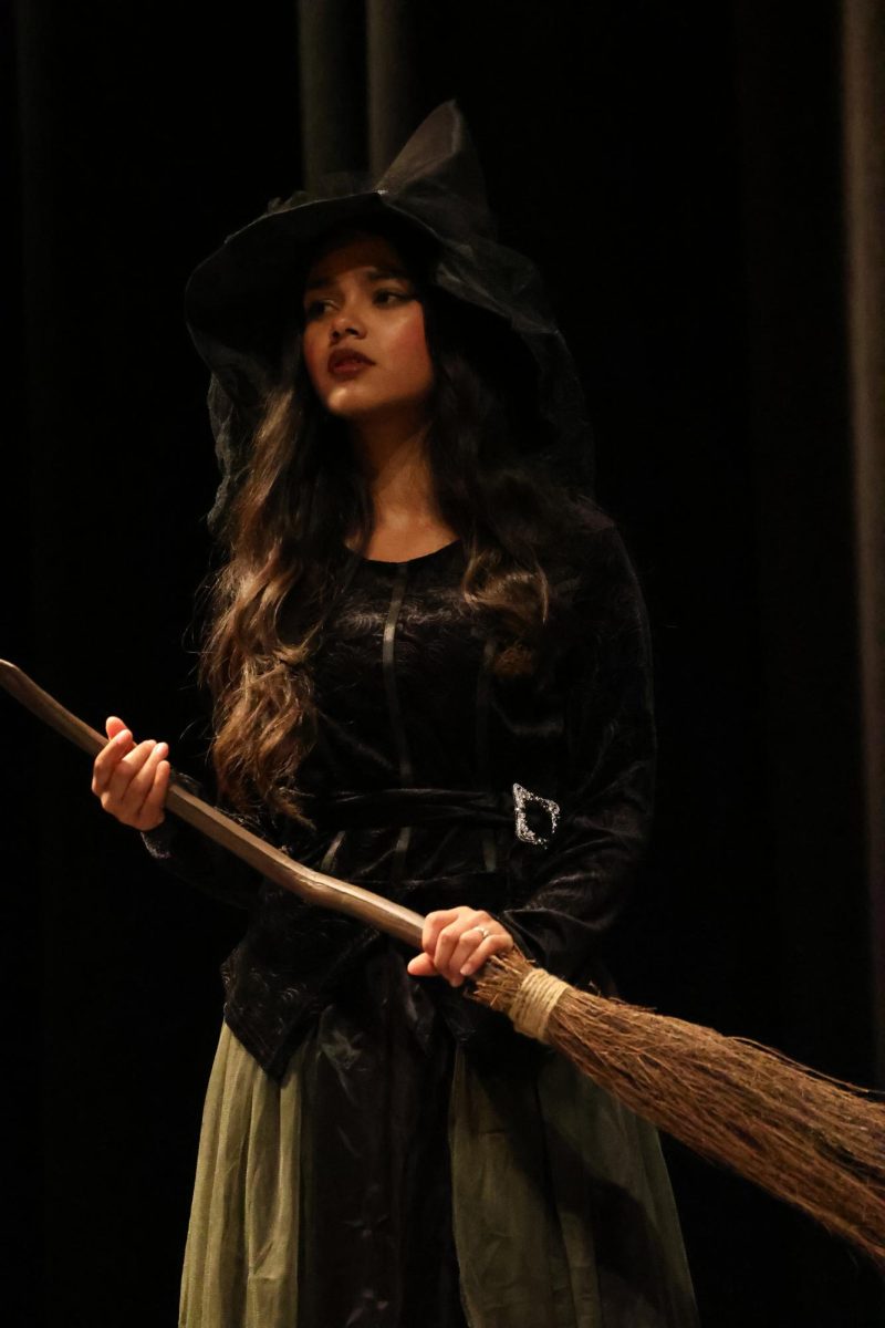 The wicked queen in the modern telling of "Snow White" is obsessed with cleverness and business acumen. She was cleverly portrayed by junior Kristina Escobar.
