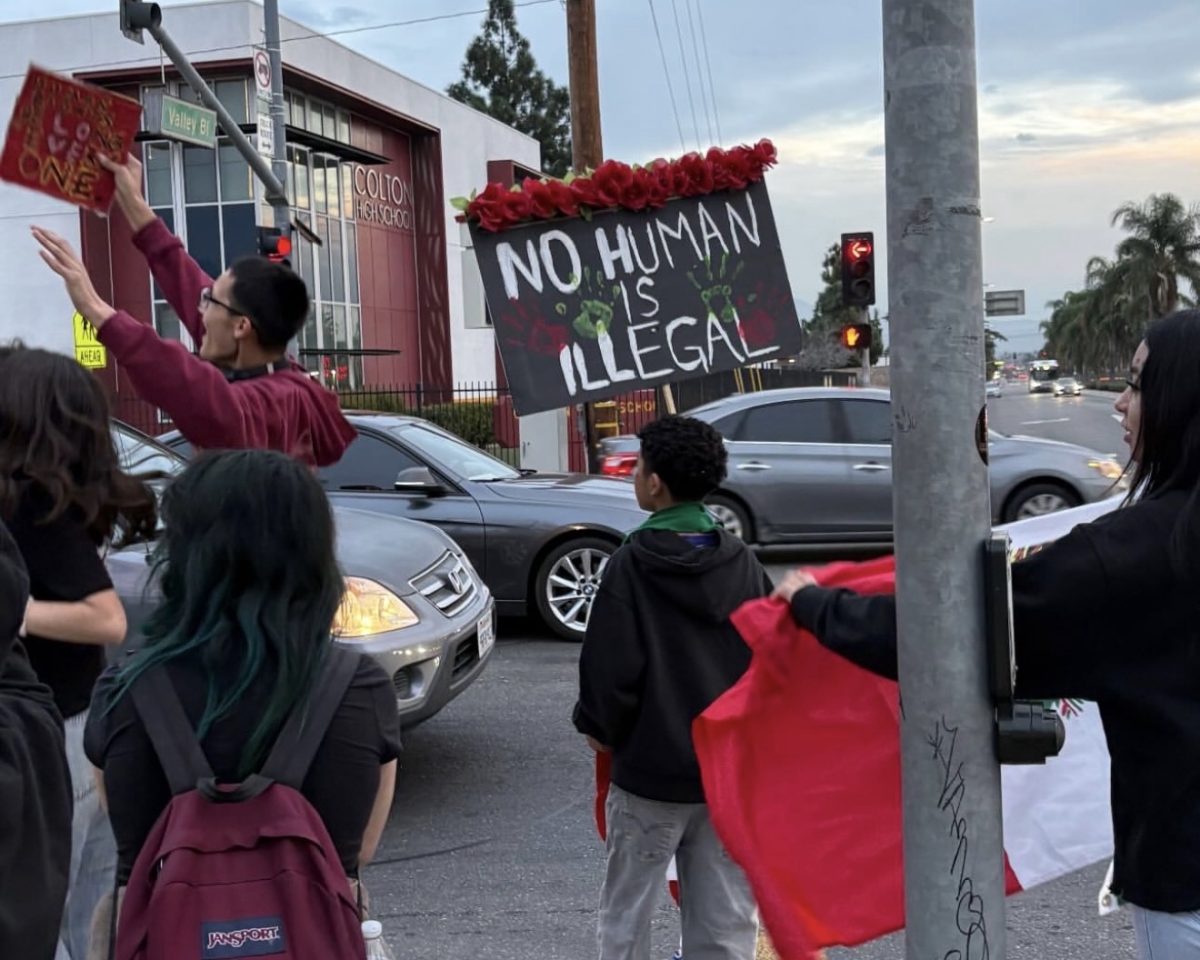 Colton High students gather on the corner of Rancho and Valley on Wednesday to protest recent actions by federal immigration officers.