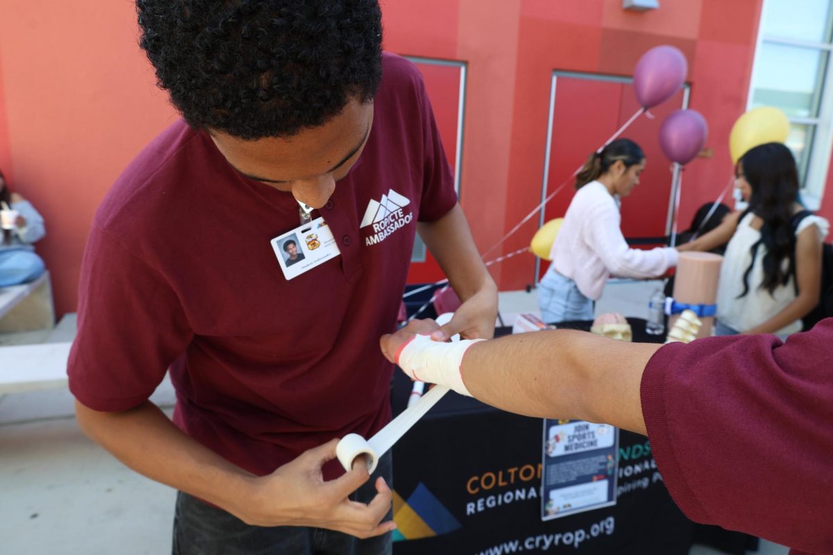 Denzel Cantrell demonstrates how to wrap a wrist injury at the CTE Showcase.