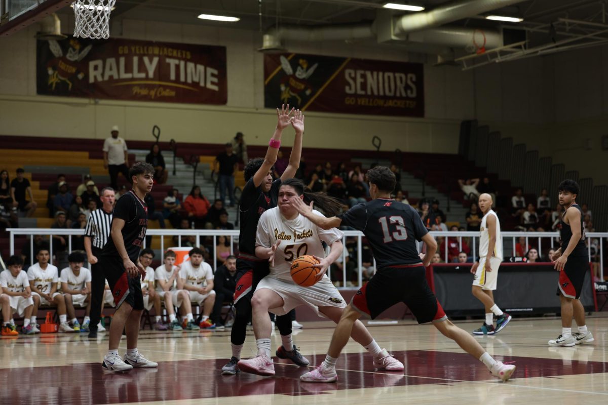 Isac Sanchez grabs the ball despite Verdugo Hills surrounding him, he would go on to scoring two points