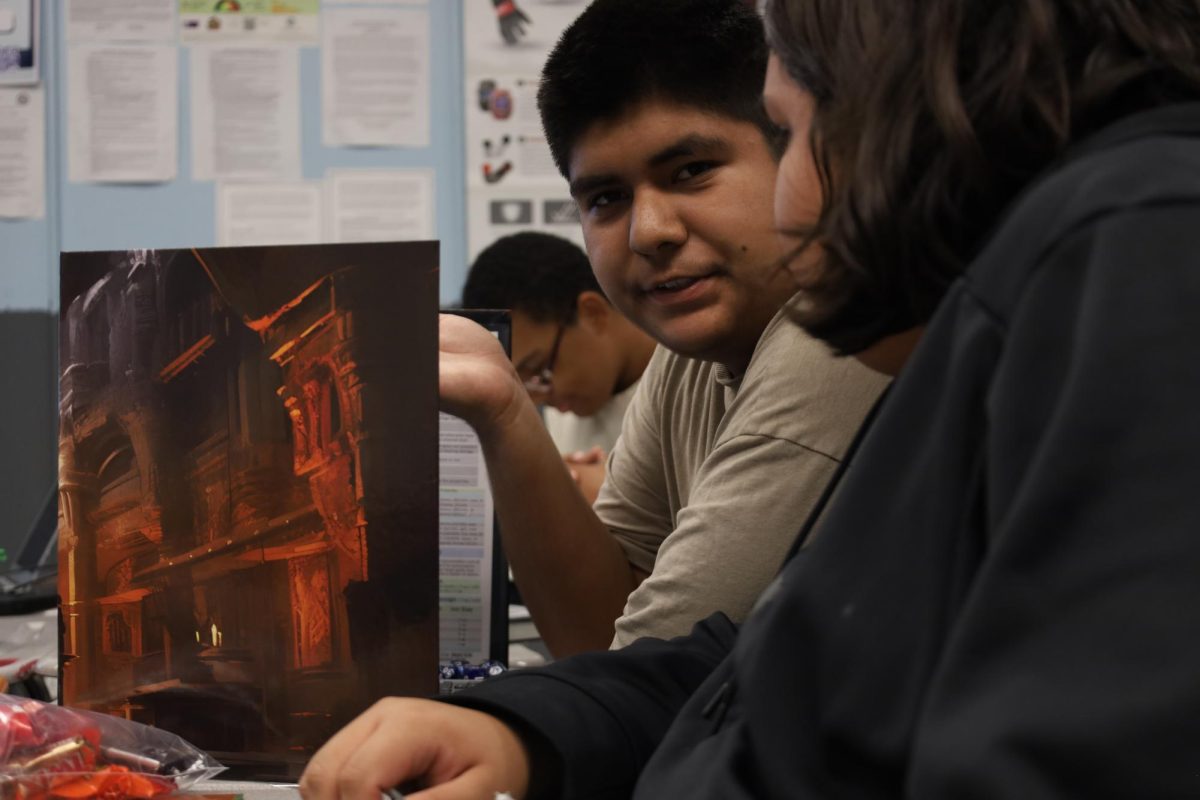 Erik Cruz Sandoval and Jayden Camacho discuss their campaign at a D&D Club meeting.