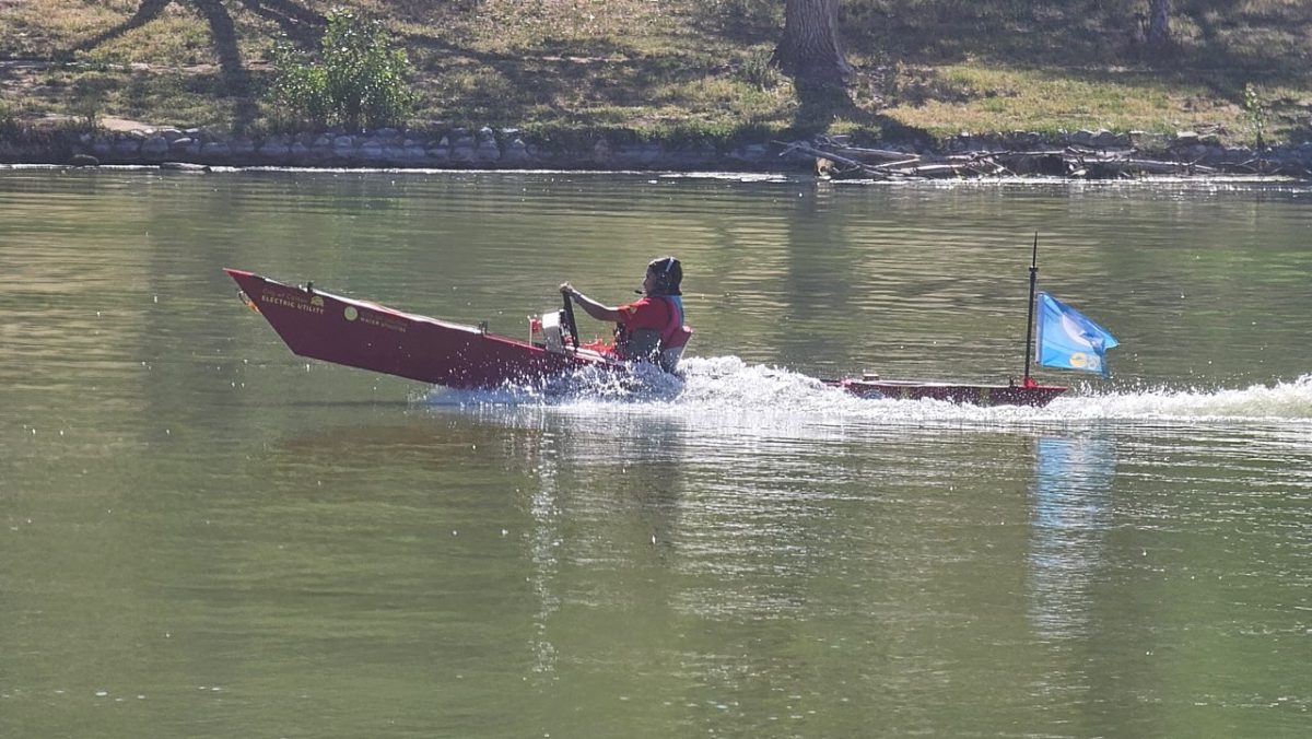 Heidi Alarcon stays the course during the slalom race as the solar boat takes on water after a sharp turn. She would still finish third in the race, despite the challenge.